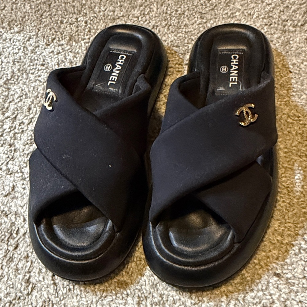 CHANEL Black Crossover Mules with Gold Accents